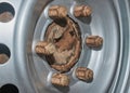 Six Car Wheel Nut on Wheel Hub and Wheel Rim Royalty Free Stock Photo