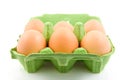 Six chicken eggs in green carton Royalty Free Stock Photo