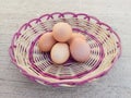 six chicken eggs on rattan wicker Royalty Free Stock Photo