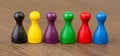 Six colored pawns isolated Royalty Free Stock Photo