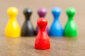 Six colored pawns, red in front Royalty Free Stock Photo