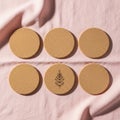 Six cork coasters arranged in two rows on a pink fabric backdrop Royalty Free Stock Photo