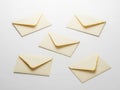 Six cream-colored envelopes arranged on a plain surface Royalty Free Stock Photo