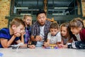 Creative school children with young asian teacher study an electronic constructor with fan and turn on flashlight Royalty Free Stock Photo