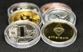 Six crypto coins piled on each other with litecoin and ethereum Royalty Free Stock Photo