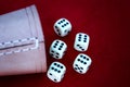 Six Dice With Cup On Red Background