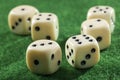 Six dices on a green table Royalty Free Stock Photo