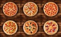 Six different pizza set for menu. Pepperoni, BBQ chicken, pepperoni cut, deluxe, pizza with ham, pizza with salami, ham and bacon