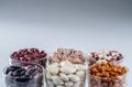 Six different varieties of beans in round glassware Royalty Free Stock Photo