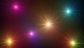 Six colorful starburst light effects on dark background Royalty Free Stock Photo
