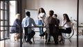 Diverse workers listening african businesswoman tell about strategy at meeting Royalty Free Stock Photo