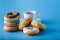 Six donuts on blue shadeless background
