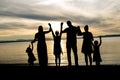 Six family member at beach silhouette sunset Royalty Free Stock Photo