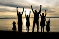 Six family member at beach silhouette sunset Royalty Free Stock Photo