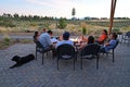 Six friends enjoy fire pit and view of Sisters, Oregon.