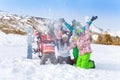 Six friends with snowboards and skis throwing snow Royalty Free Stock Photo