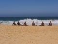 Six guys watching the surf