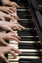 Six hands on piano Royalty Free Stock Photo