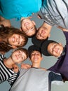 Six happy teenagers standing in the circle