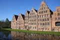 Six historic brick buildings that were used as salt storehouses on the Upper Trave River Lubeck, Germany. Royalty Free Stock Photo