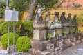 Six Jizo bodhisattva sitting stone statues in the Tamonji Temple of Sumida ward.