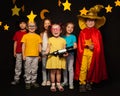 Six kids in stargazers costumes with telescope