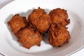 Six large Indian onion bhajis from an Indian restaurant. Royalty Free Stock Photo