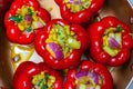 Stuffed peppers. Six large red bell peppers stuffed and ready for the oven Royalty Free Stock Photo