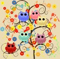 Six lovely owls blue, red, pink, yellow, purple, blue with huge eyes sitting on a fantastic tree with flowers Royalty Free Stock Photo