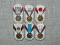 Six metal badges depicting the Olympic medal and the inscription-Soviet athletes at the Olympic games