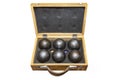 Six metal balls placed in a old wooden box, used in game petanka, isolated on a white background with a clipping path. Royalty Free Stock Photo