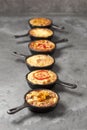 Six mini quiches in pans