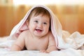 Six month baby girl lying wrapped towel after bathing Royalty Free Stock Photo