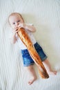 Six months old baby girl eating bread Royalty Free Stock Photo