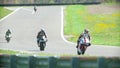 Six motorcyclists on the race track, slow-motion