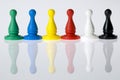 Six multi-colored board game pieces Royalty Free Stock Photo