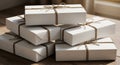 Six neatly stacked rectangular packages are wrapped in plain white paper and tied Royalty Free Stock Photo