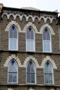 Six ornate windows with gorgeous decorative stone