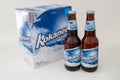 A six pack box of Kokanee with a couple of beer bottles Royalty Free Stock Photo