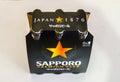 Six pack of Sapporo premium export Beer isolated on white background. The Japanese brewery was founded in 1876 by German.