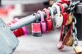 Six padlocks on the pipe. Old, rusty. Blurred background, chain, bridge. Royalty Free Stock Photo