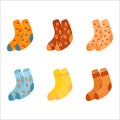 A collection of warm multi colored flat socks isolated on a white background