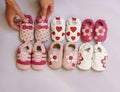 Six pairs of baby shoes on display Royalty Free Stock Photo