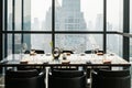 Six people dinner table with plates, knives, forks, wine glasses, glasses and napkins on marble table top with Bangkok cityscape. Royalty Free Stock Photo