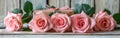 Six Pink Roses and Giftbox on Rustic White Wooden Background - Romantic Floral Gift Idea for Any Occasion Royalty Free Stock Photo