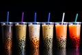 Six plastic cups of bubble tea in a row. Popular asian tapioca teenagers drink. Royalty Free Stock Photo