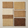 Six rectangular samples of textured woven straw material are displayed on a plain Royalty Free Stock Photo