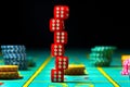 Six red dice are stacked on a gaming table in a casino. Dice for poker or craps and casino chips on black background Royalty Free Stock Photo