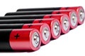 Six red finger-type batteries of the AA size on a white background