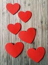 Six Red Hearts on Wood